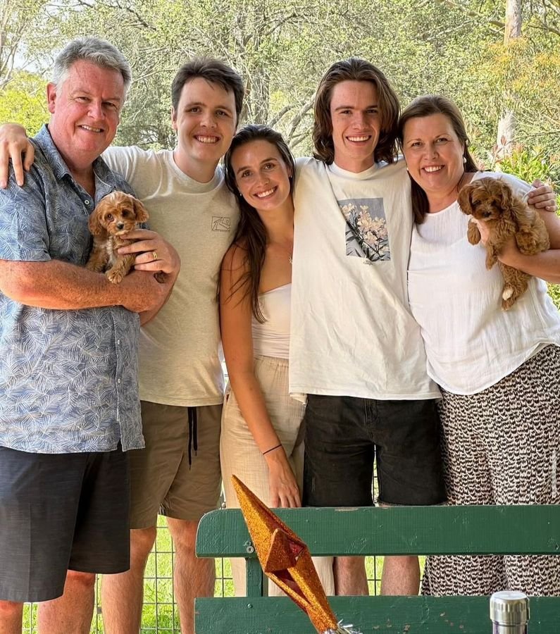 Photo of Brown Family with their Cavoodle