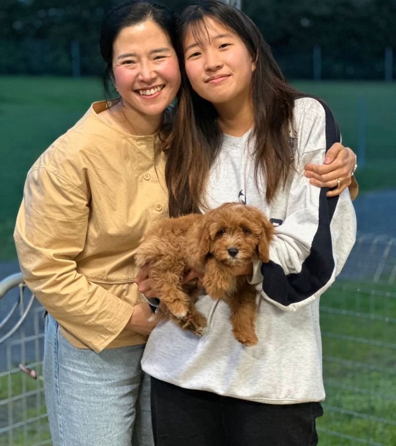 Photo of Jessica Brown and Ava Brown with their Cavoodle