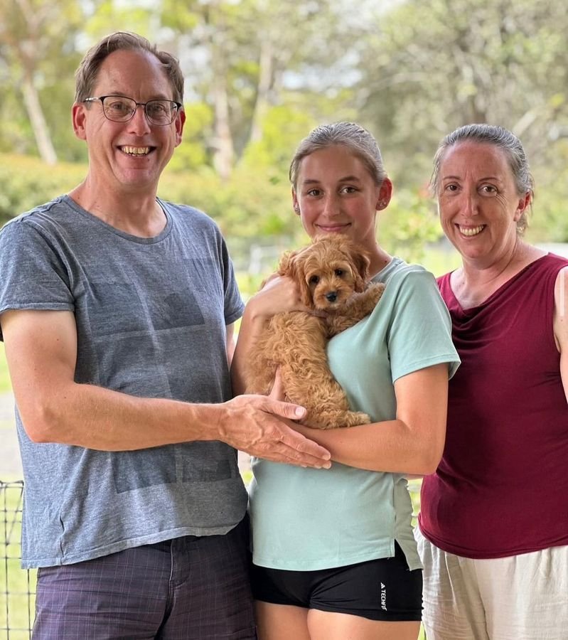 Photo of Johnson Family with their Cavoodle