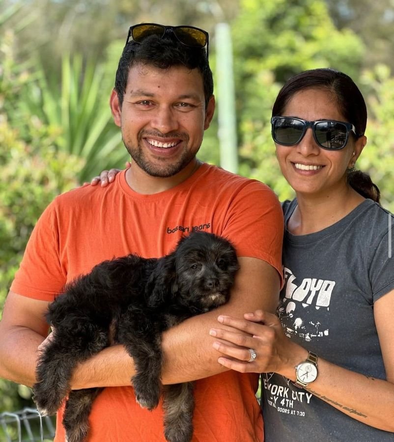 Photo of Liam O'Connor and Chloe with their Cavoodle