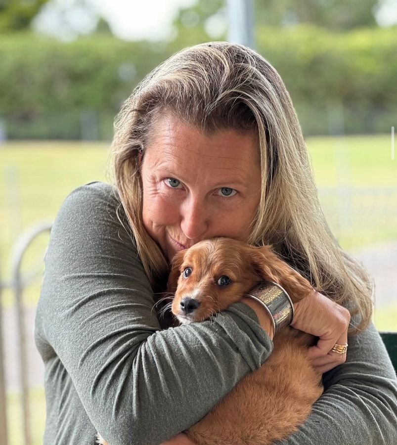 Photo of Olivia Turner with their Cavoodle